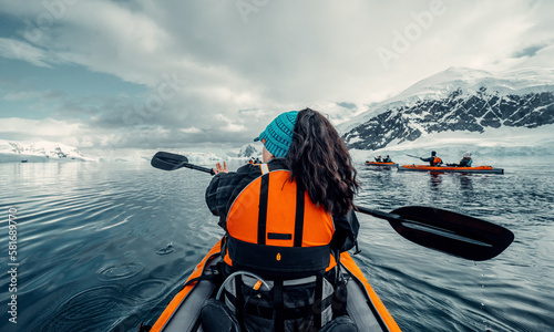 Female Kayaker Paddling Her Way Through Calm Waters of Antarctica, Woman in Orange Life Vest, Scenic Views of Arctic landscape