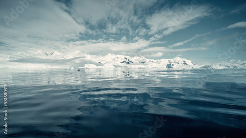 Water Level Seascape in Antarctica of Snow Covered Mountains Reflecting on Water, Scenic landscape