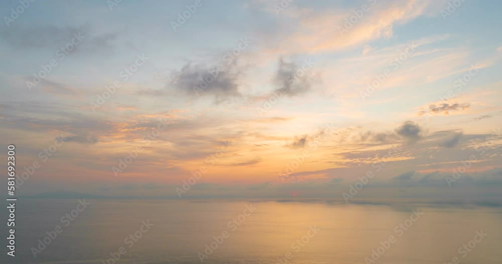4K Time lapse of colorful sunrise or sunset landscape background. Amazing light of nature blue sky pastel pink moving cloud and golden yellow cloudscape timelapse in tropical summer spring sunlight.