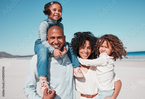 Family, smile and portrait piggyback at beach on vacation, bonding and care at seashore. Holiday relax, summer ocean or happy father, mother and kids, girls or children enjoying quality time together © Clayton D/peopleimages.com