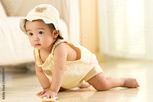 The lovely baby girls playing on the floor photo