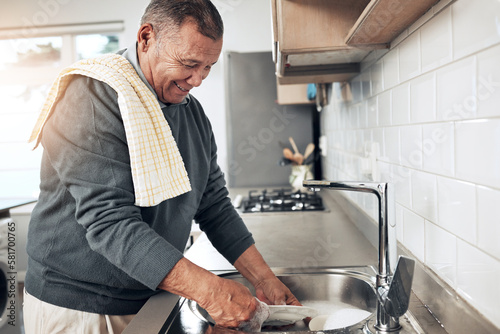 Cleaning, washing dishes or happy old man with soap and water in the kitchen sink in healthy home. Dirty, messy or senior person with liquid foam to disinfect, protect and prevent bacteria or germs