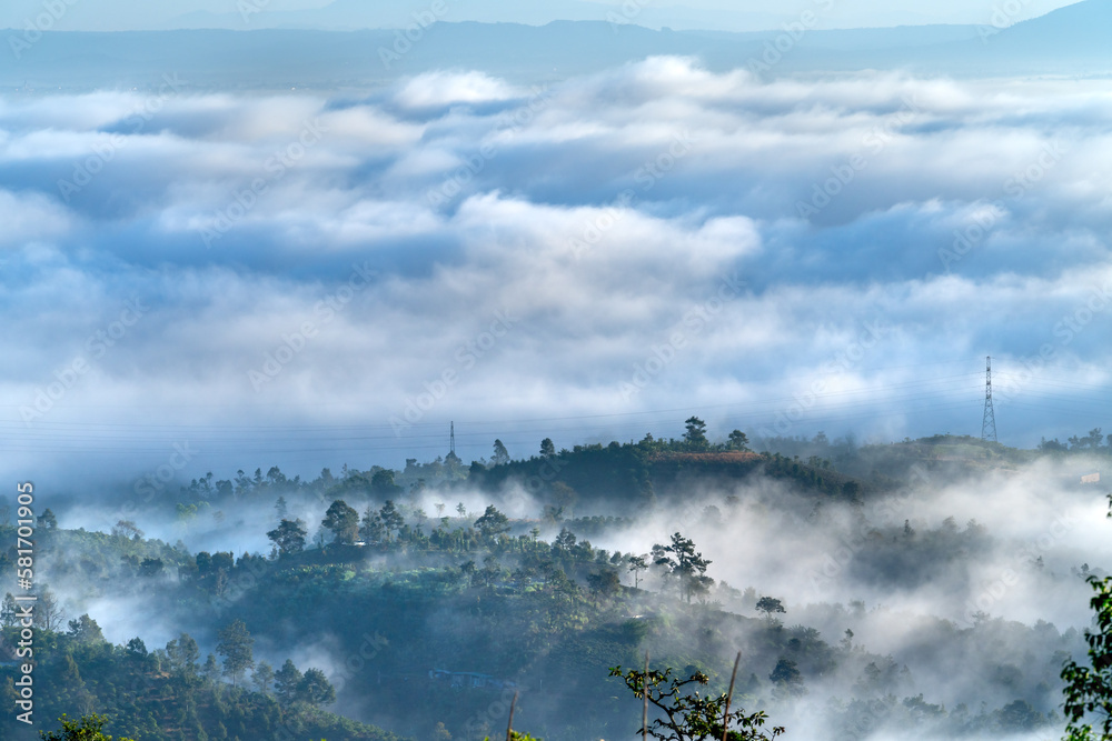 Fanciful scenery of an early morning when the sun rises over the Dai Lao mountain range, Bao Loc district, Lam Dong province, Vietnam Fanciful scenery of an early morning when the sun rises over the Dai Lao mountain range, Bao Loc district, Lam Dong province, Vietnam