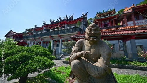 Flowers are blooming, and the temple scenery is full of greenery. A Taoist temple with a history of hundreds of years. Gongbei Temple, Taiwan. photo