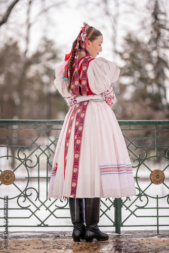 Beautiful woman wearing traditional Eastern Europe folk costumes. Slovak folk costumes.
