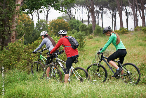 Its safer to ride in numbers. A group of young cyclists riding a trail.