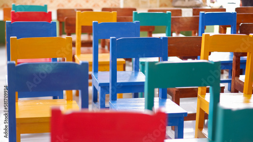 Gorup of colourful empty chairs in the kindergarten