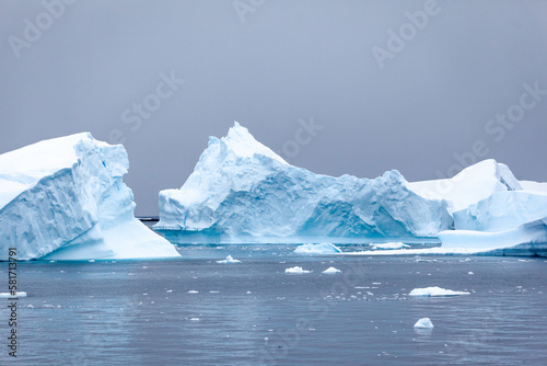 Stark, stunning and each unique, huge icebergs are sculpted by nature and weathered by changing climate as they float slowly through the antarctic oceans.