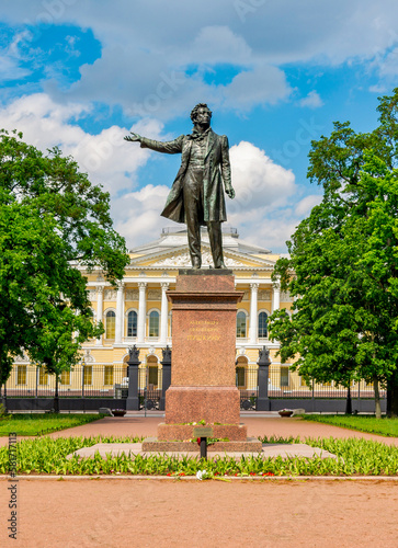 Monument to Russian poet Alexander Pushkin on Culture square and Russian museum at background, Saint Petersburg, Russia (sign "to Alexander Serveevich Pushkin")