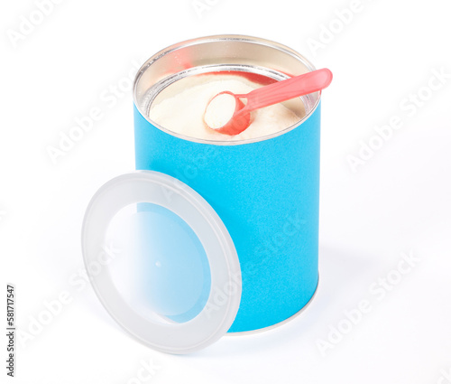Baby milk powder in can that is open, with a spoon
