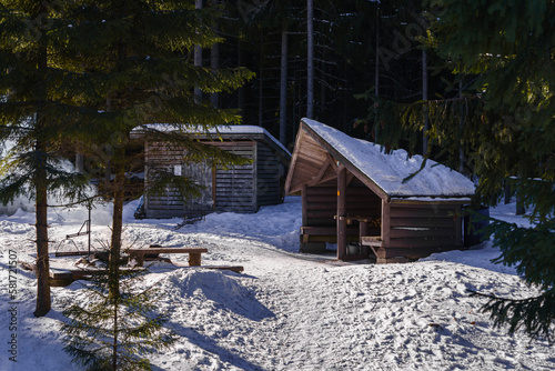 Aurinkovuori Lean-to shelter in a sunny winter day. Vaaksy, Finland. photo