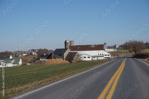 White Barn, Farm Fields by Roadside in Winter photo