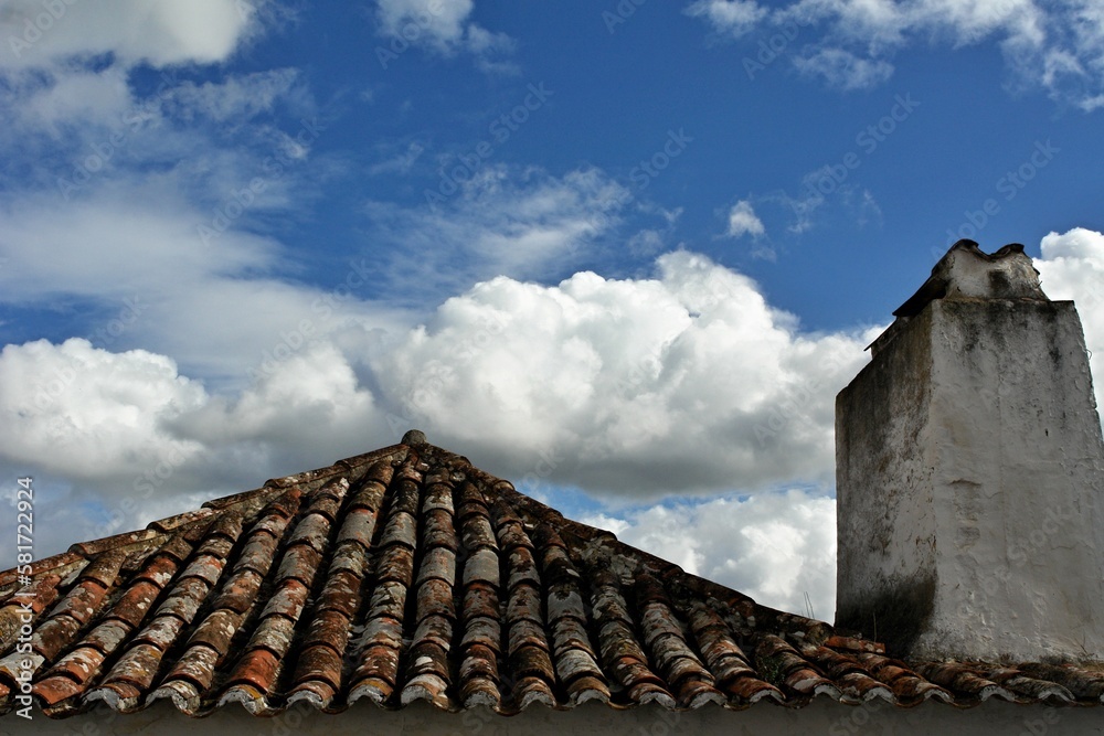 Traditional old roof with cloudy sky in Portugal 