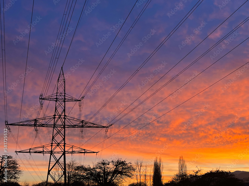 electric power lines in colorful evening sky