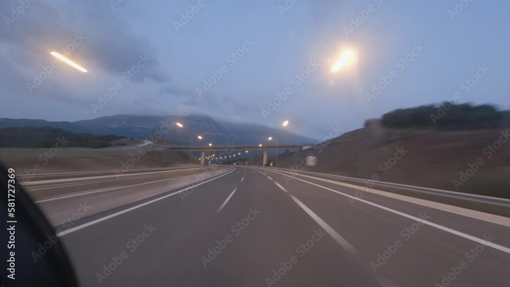 Time lapse pov driving fast speed on highway road at dusk with tunnels