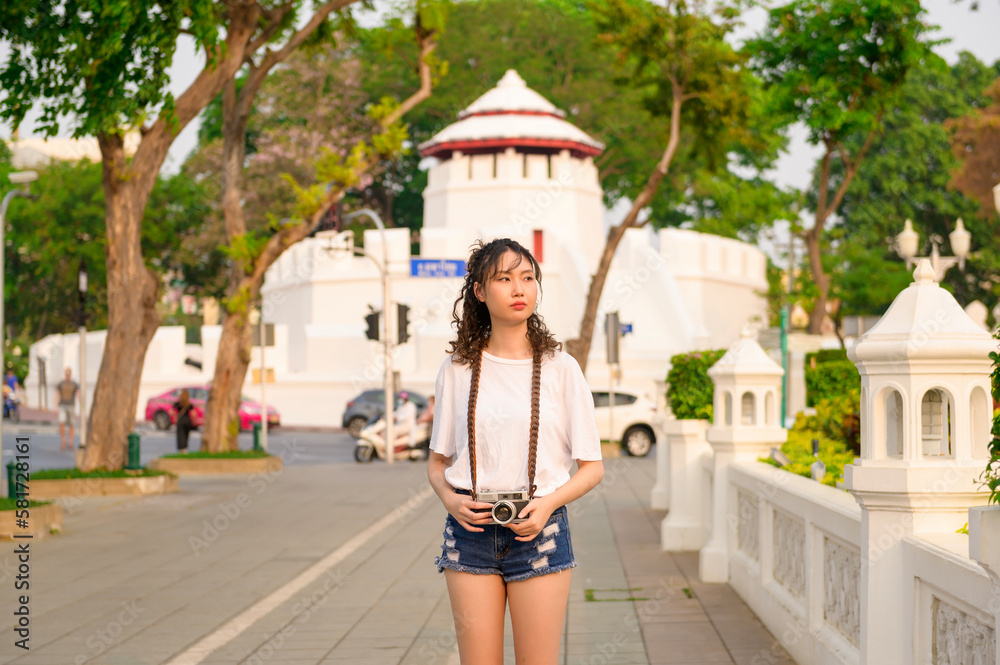 Beautiful young Asian tourist woman on vacation sightseeing and exploring Bangkok city, Thailand, Holidays and traveling concept Beautiful young Asian tourist woman on vacation sightseeing and exploring Bangkok city, Thailand, Holidays and traveling concept