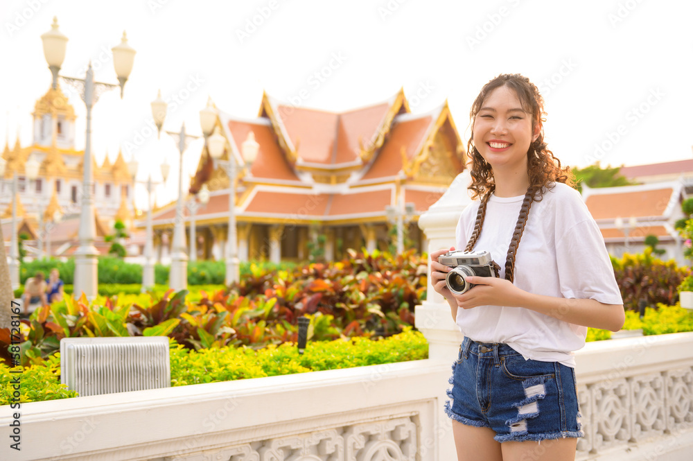 Beautiful young Asian tourist woman on vacation sightseeing and exploring Bangkok city, Thailand, Holidays and traveling concept - obrazy, fototapety, plakaty 