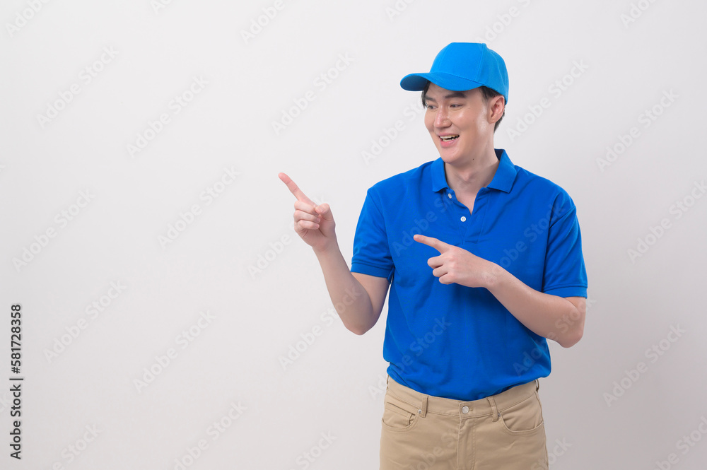 An Asian young Technician service man wearing blue uniform on white background studio An Asian young Technician service man wearing blue uniform on white background studio