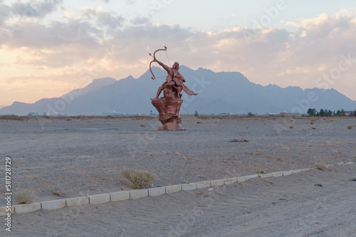 Low-angle view of the Arash the Archer near the Gate of Farafar, Mehriz city in Yazd Province, Iran photo