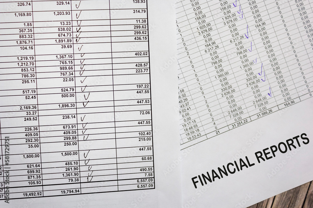Close up financial statement report, monthly book, bank account, savings book, saving money Close up financial statement report, monthly book, bank account, savings book, saving money