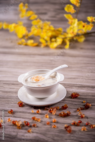 traditional ice cold chilled colourful fruit peach gum bo bo cha cha sweet soya bean coconut milk soup in white bowl on wood background sweet dessert halal menu
