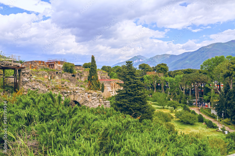 The hills of Pompeii. Ruins of broken town on the beautiful mountains background