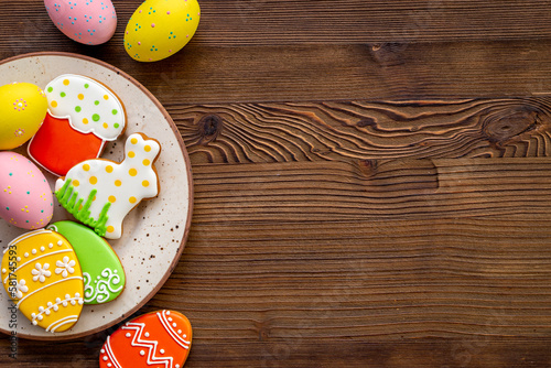 Happy Easter background with sweets and cookies eggs, top view