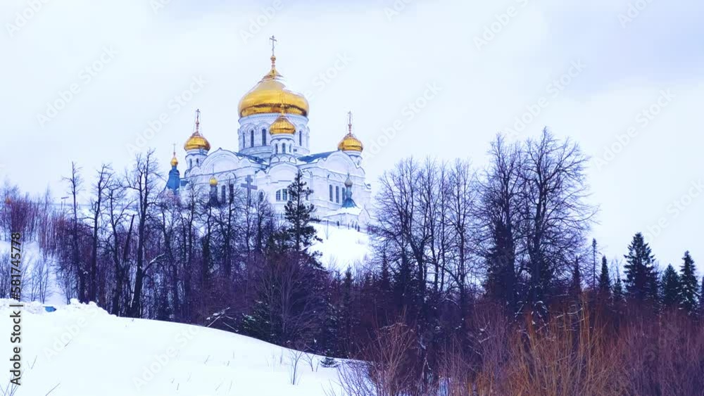 Belogorsky St. Nicholas Orthodox Missionary Monastery. Russia, Perm Krai, Belaya Gora. The temple on the hill in winter. Monastery on the background of snow. 4K Belogorsky St. Nicholas Orthodox Missionary Monastery. Russia, Perm Krai, Belaya Gora. The temple on the hill in winter. Monastery on the background of snow. 4K