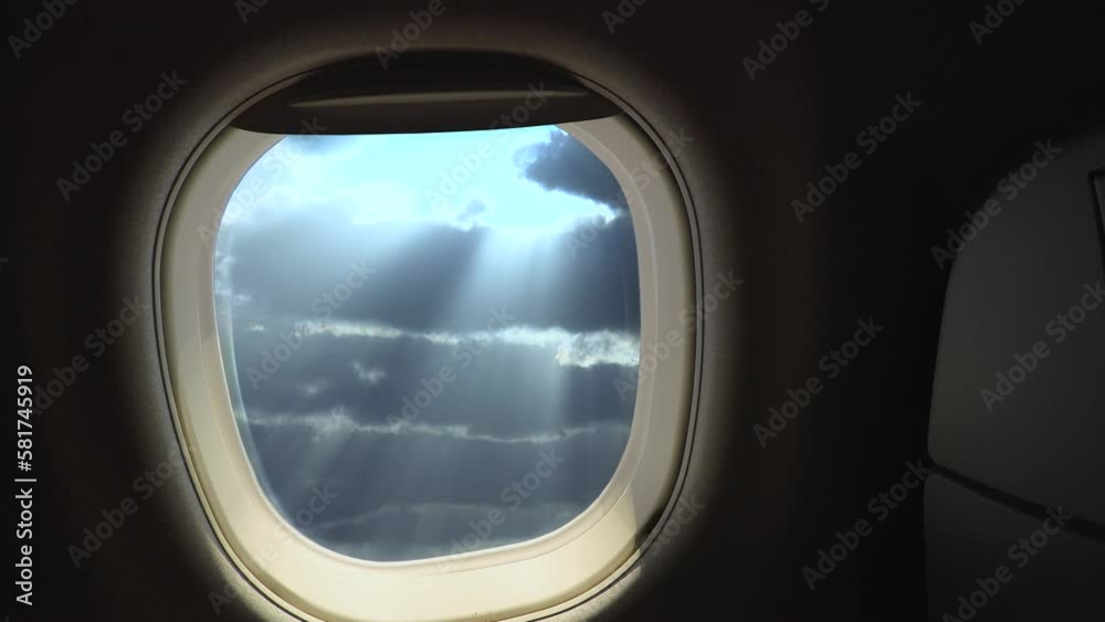 Sun rays in the clouds from an airplane window. Sun rays in the clouds from an airplane window.