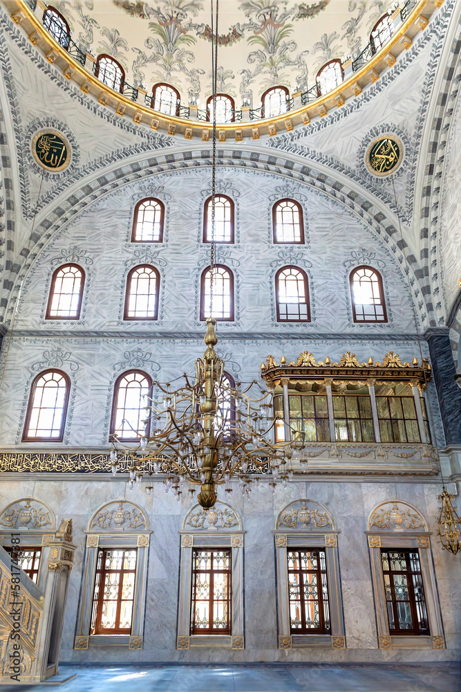 Interior of prayer hall in the Nuruosmaniye Mosque, Istanbul, Turkey. Balcony for aristocrat women praying. Ottoman baroque style. Arabic text as decor (verses from Koran, muslim Holy book).