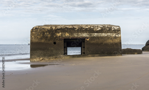 World War 2 bunker (The Atlantic Wall) on a French beach (la Grande Côte) at Saint-Palais-sur-Mer. There are graffiti and carved inscriptions on the blockhaus walls.