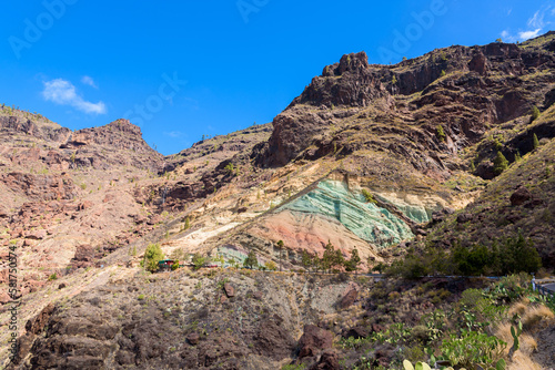 Monumento Natural Azulejos de Veneguera, also known as Rainbow Rocks in Mogán, Las Palmas, Gran Canaria, Spain.