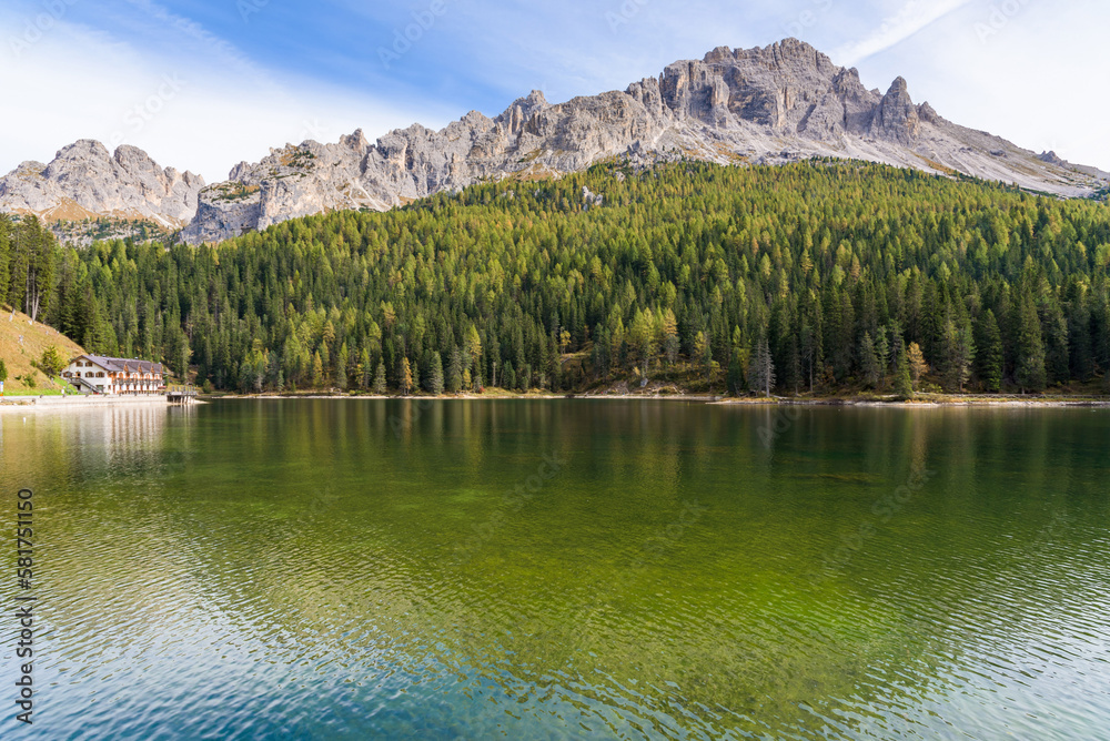 Lake Misurina in the Italian Dolomites near Cortina D'Ampezzo. Sunny summer day with blue sky and clouds