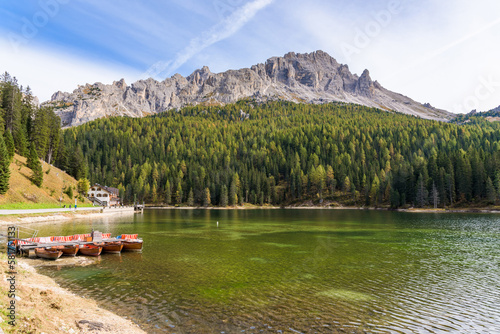 Lake Misurina in the Italian Dolomites near Cortina D'Ampezzo. Sunny summer day with blue sky and clouds