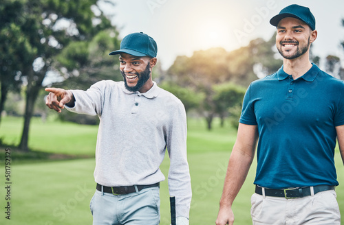 Friends, men on golf course and black man pointing, walking and talking on grass at game. Health, fitness and friendship, happy golfer man and friend with smile walk in nature on weekend together.