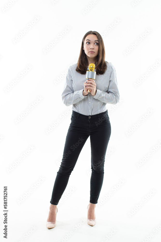 The women is shy to sing into the microphone. Photo on a white background The women is shy to sing into the microphone. Photo on a white background