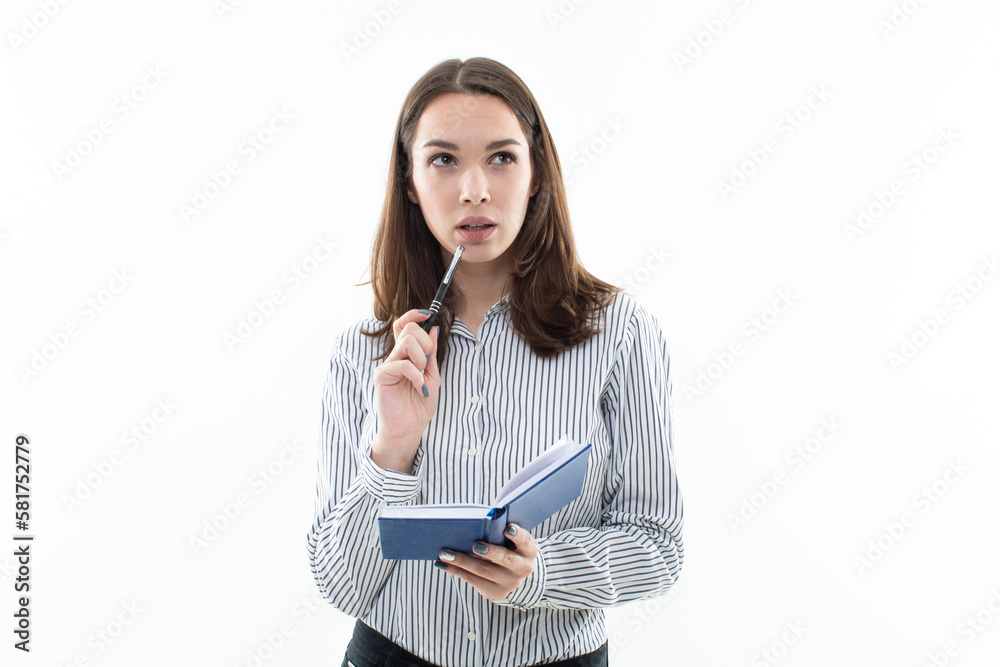 A close-up of a smiling female office worker holding a notepad and put on a white background, ready to take notes