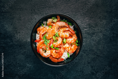 close-up of rice with fried shrimp on a black background