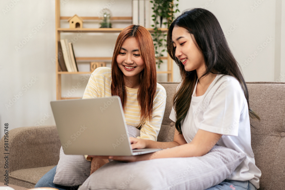 Young woman lesbian couple using laptop to chatting with friends