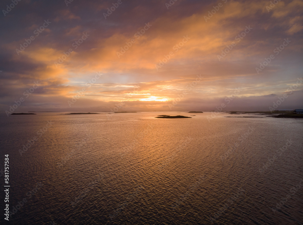 Sunset in Iceland, drone shot over the sea, lake