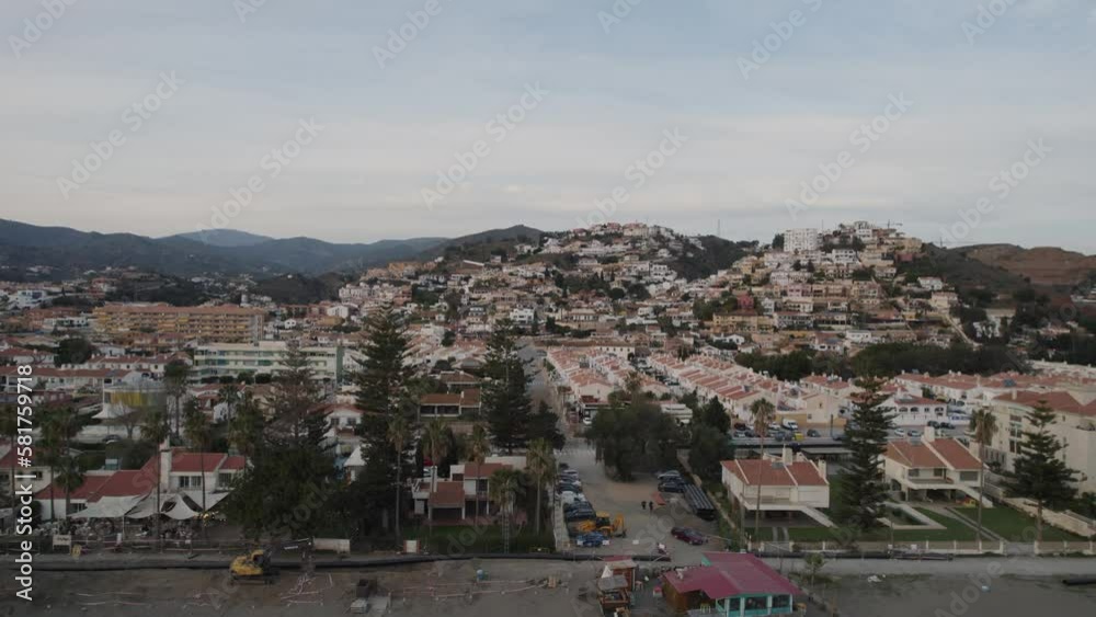 Aerial Dolly Ascending Shot Over Alboran Sea Over Beach With Malaga Townscape In Background Aerial Dolly Ascending Shot Over Alboran Sea Over Beach With Malaga Townscape In Background
