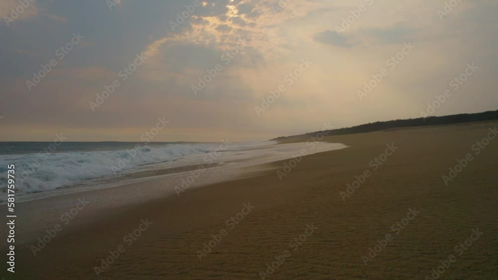 Aerial Low Flying Over Empty Oaxaca Beach With Sunset Light Rays. Dolly Forward Aerial Low Flying Over Empty Oaxaca Beach With Sunset Light Rays. Dolly Forward