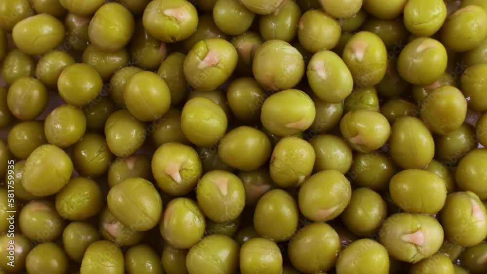 Top view of marinated sweet green peas texture circle rotation close up Top view of marinated sweet green peas texture circle rotation close up