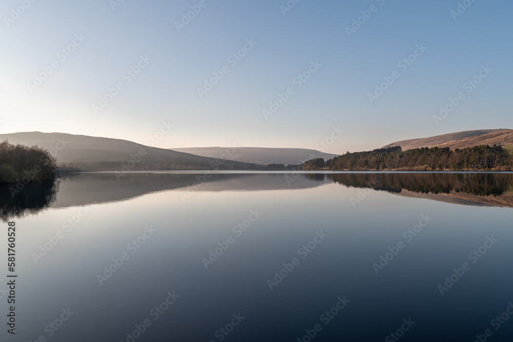Reflections in Catcleugh Reservoir on a very clear calm day in Northumberland, England