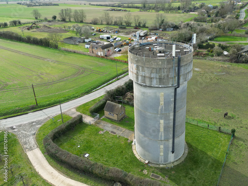 Stampa su tela Drone view of a concrete water tower which has an array of 5G antennas on its circular roof