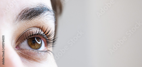 Tablou pe pânză Close-up of a woman's eye after an eyelash lamination procedure.