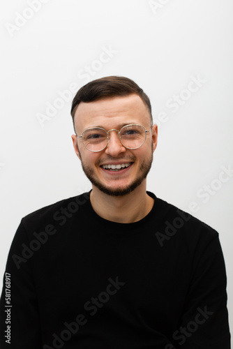 young man in glasses expressing smiling emotions, smile