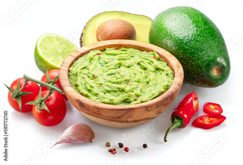Guacamole bowl and guacamole ingredients isolated on white background. photo