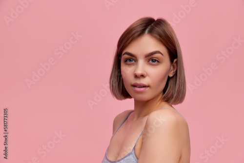 Half-length portrait of young beautiful girl without makeup on face. Model looking at camera. Concept of skin care, beauty, spa, anti-aging procedures. Banner