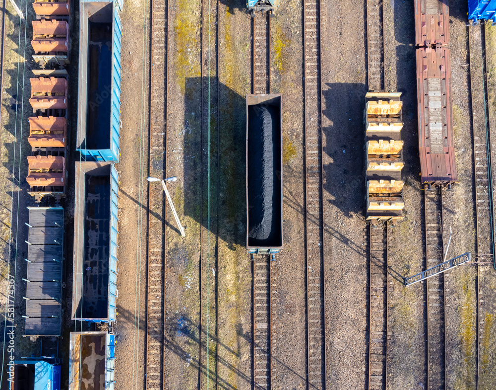 Aerial view landscape. Tracks and trains. Coal wagon. Transportation.